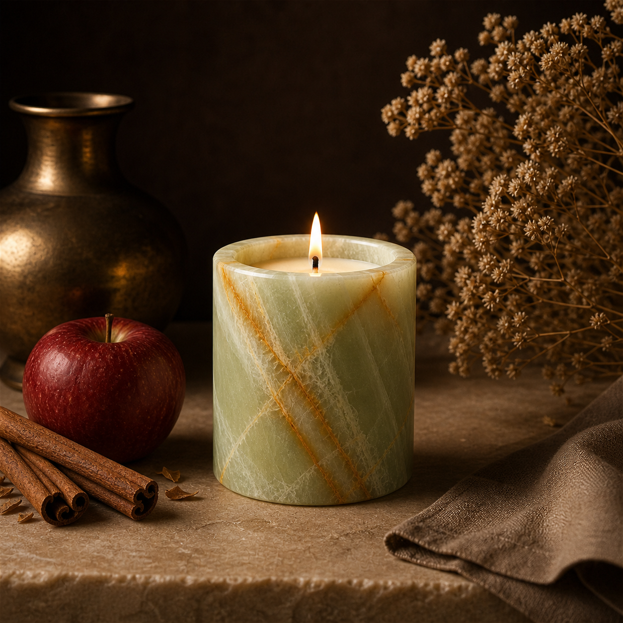 Apple Cinnamon soy candle lit in a warm styled setting