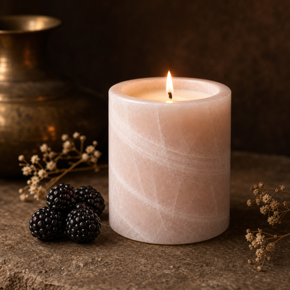 Blackberry soy candle lit in a warm styled setting