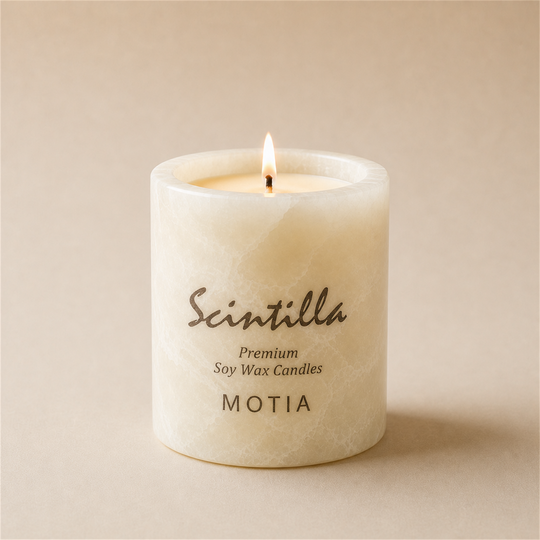 Scintilla Motia scented candle in a hand-carved white onyx jar